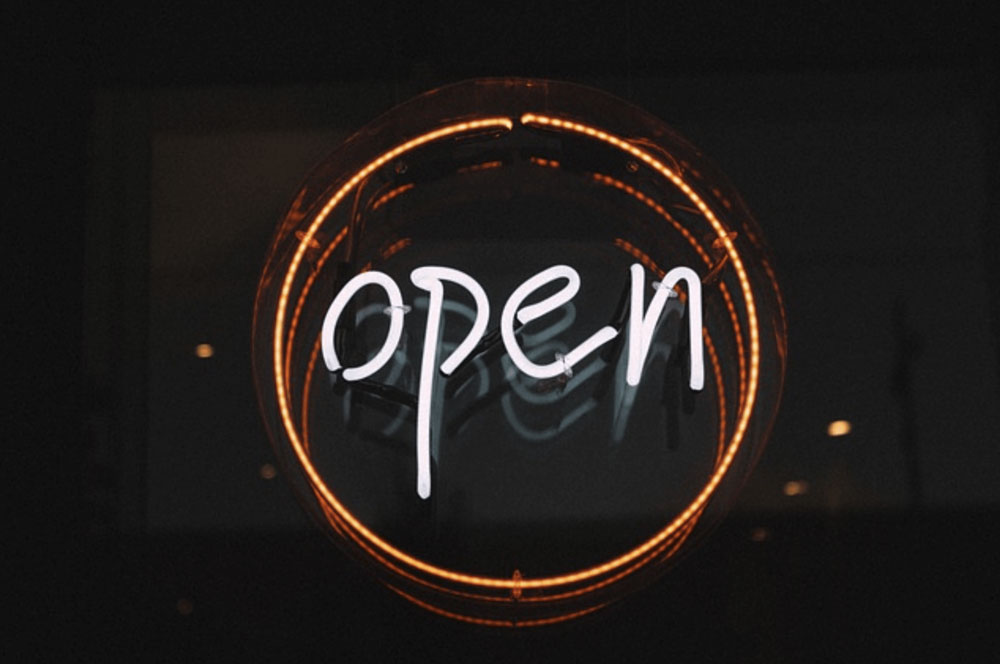 a dark "open" sign that is illuminated