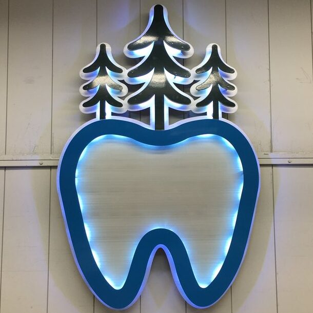 an illuminated custom sign for BH dentures