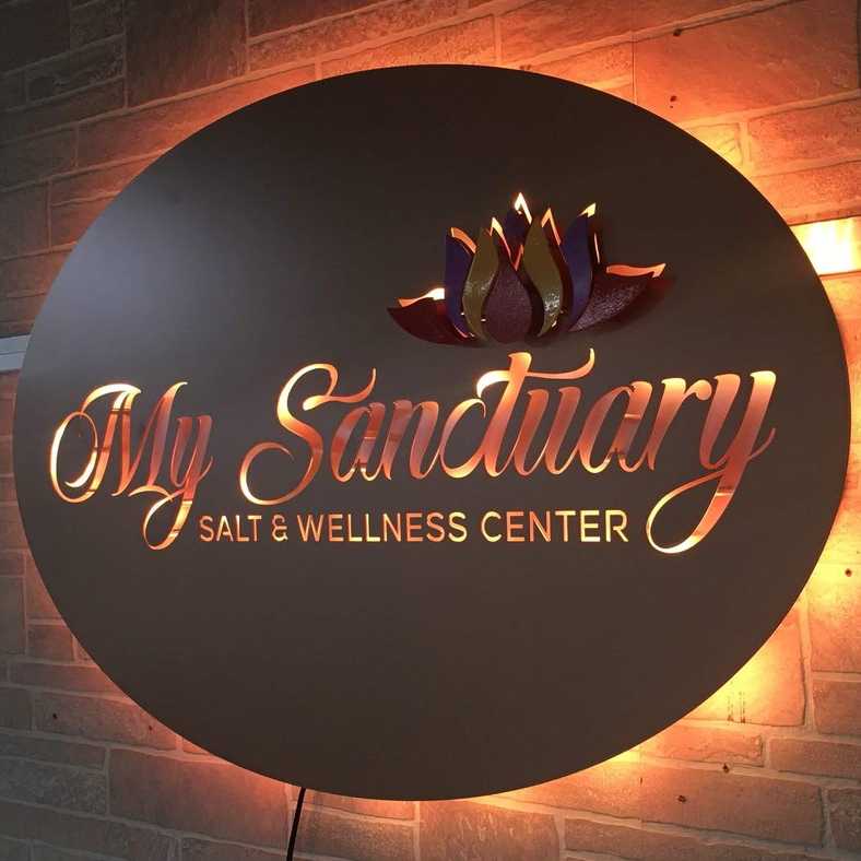 illuminated my sanctuary wellness center sign