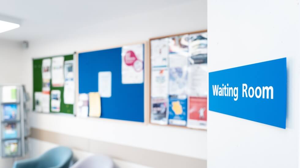 HS hospital waiting room sign seen in a British hospital