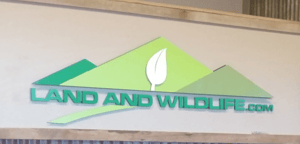 Land and Wildlife Realtors Lobby Sign