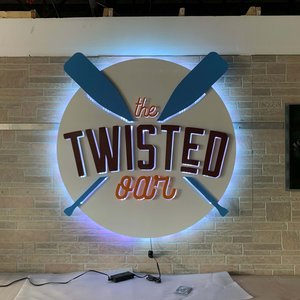 a custom metal sign for The Twisted Oar restaurant