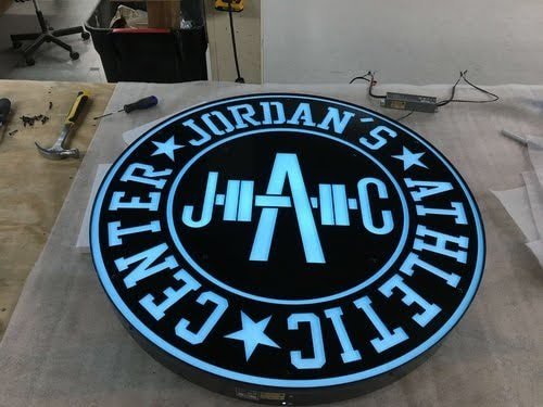 a custom personalized metal sign for an in home gym