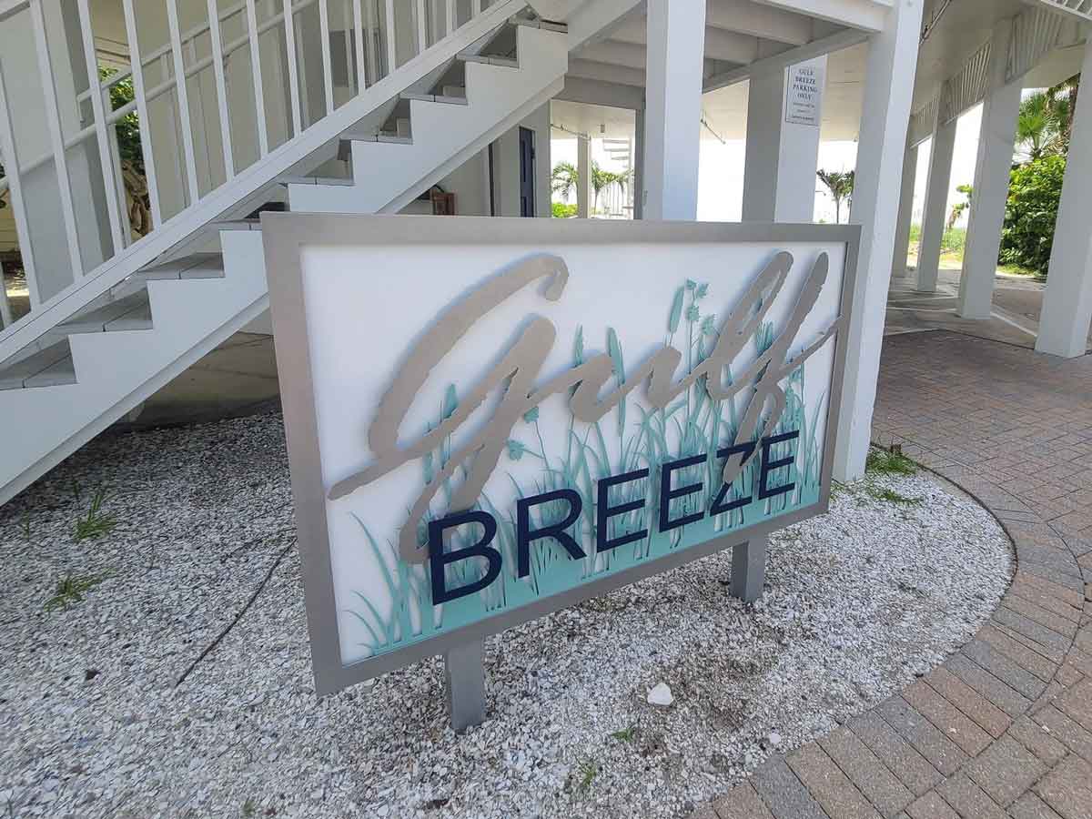 a custom sign for a vacation home that says girly breeze