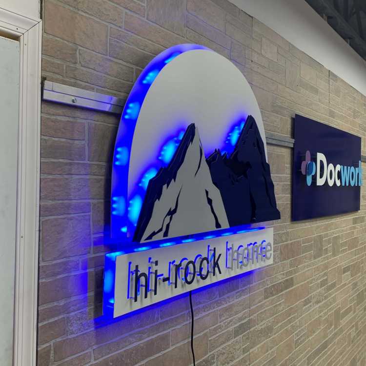 custom illuminated sign for the hi rock home company in a brushed aluminum finish