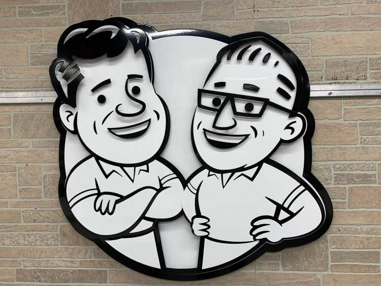 custom metal sign with two men