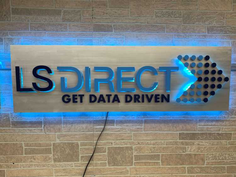 illuminated custom sign for ls direct and their slogan get data driven