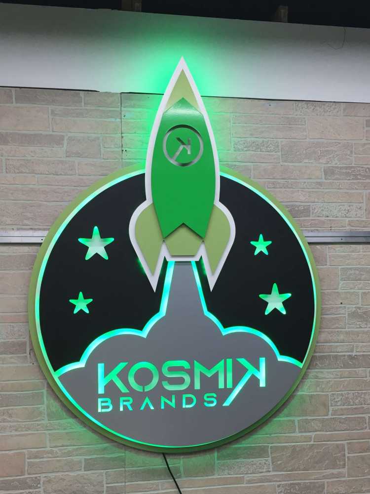 custom illuminated sign for the kosmik brands company