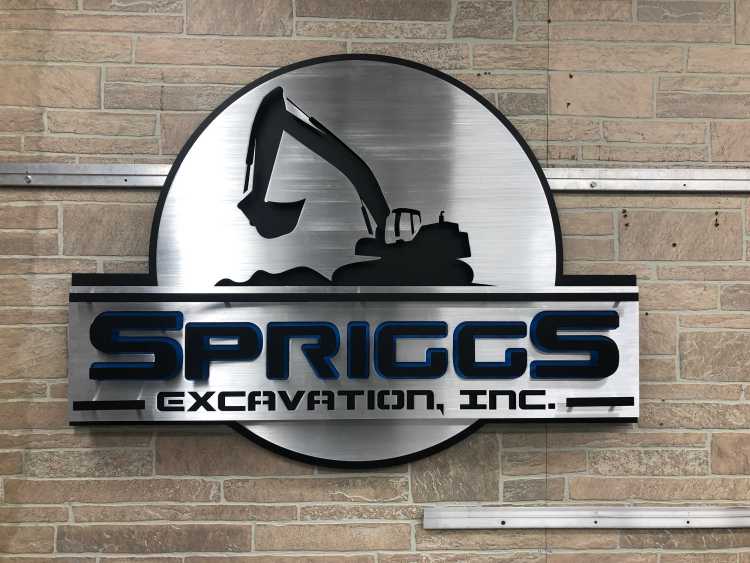 custom sign for the spriggs excavation incorporation with brushed aluminum finish