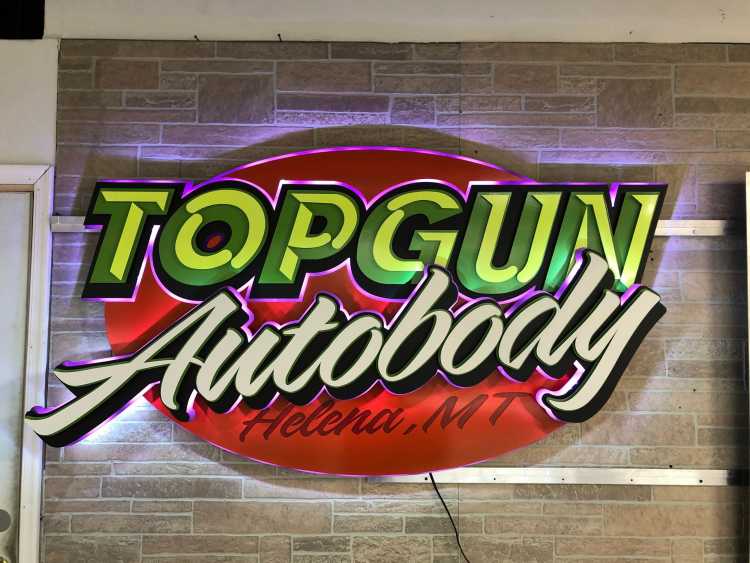 custom illuminated sign for the topgun autobody shop in helena montana