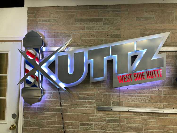 custom illuminated sign for uttz west side kuttz barber shop