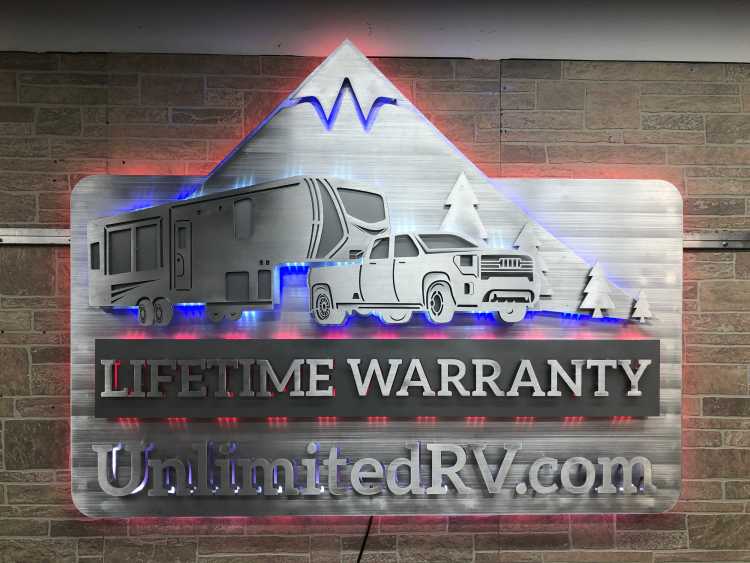 custom illuminated sign in brushed aluminum for the lifetime warranty as offered by the unlimitedrv dot com site