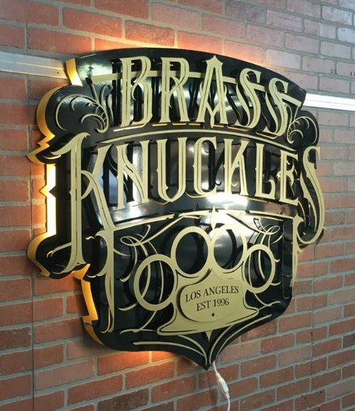 Brass Knuckles custom signage