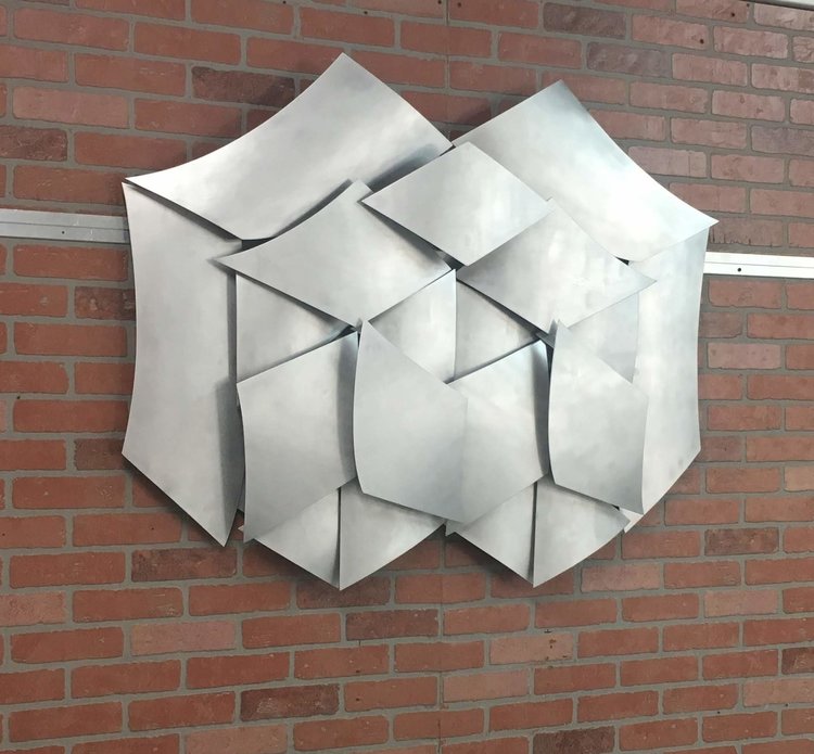 custom brushed metal geometric sign