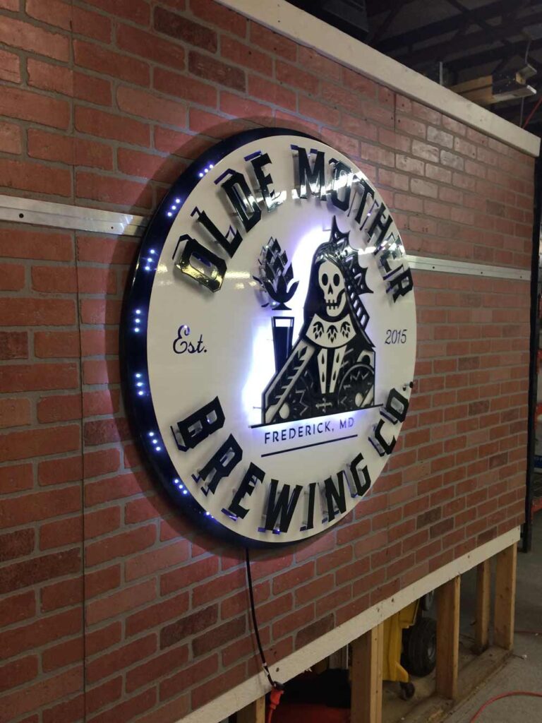 custom LED backlit sign at a brewing company