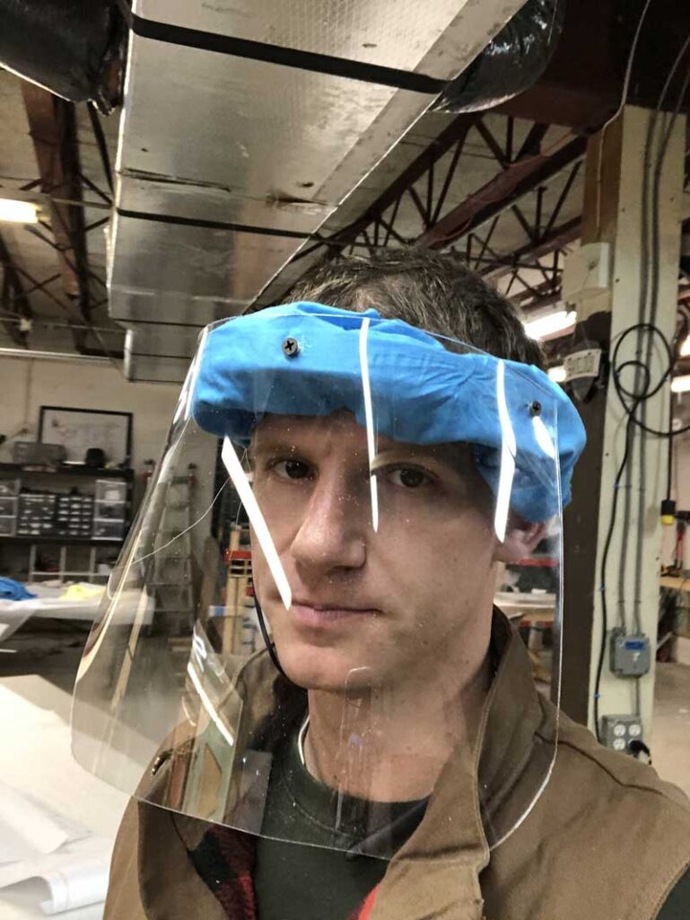 ShieldCo employee wearing full fledged face mask